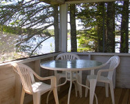 South and West facing porch with seating for four at the table