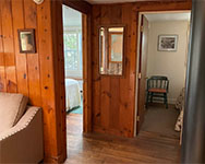 Queen bedroom (L) with double bedroom (R) from the living area