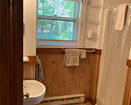 Old-fashioned shower bath, facing north - please remember to bring your own linen